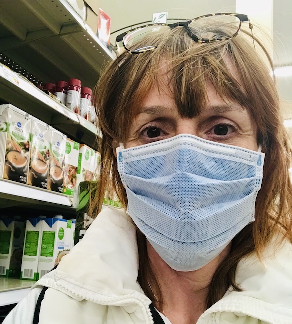 Emily in grocery store with facemask